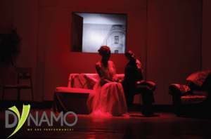 Podkolyosin dodges the innocent advances from Agafya in the Dynamo theatre production of Gogol's play Marriage
