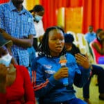An audience member describes her understanding of the characters situation as depicted in Tunde Euba's Theatre play INCONTROL Reloaded as directed by Arthur Kisenyi