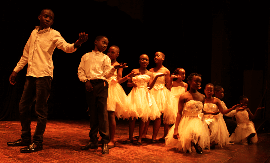 the kids in dance Choreographed by Joana Mbabazi in the Dynamo theatre Production of a Christmas Carol